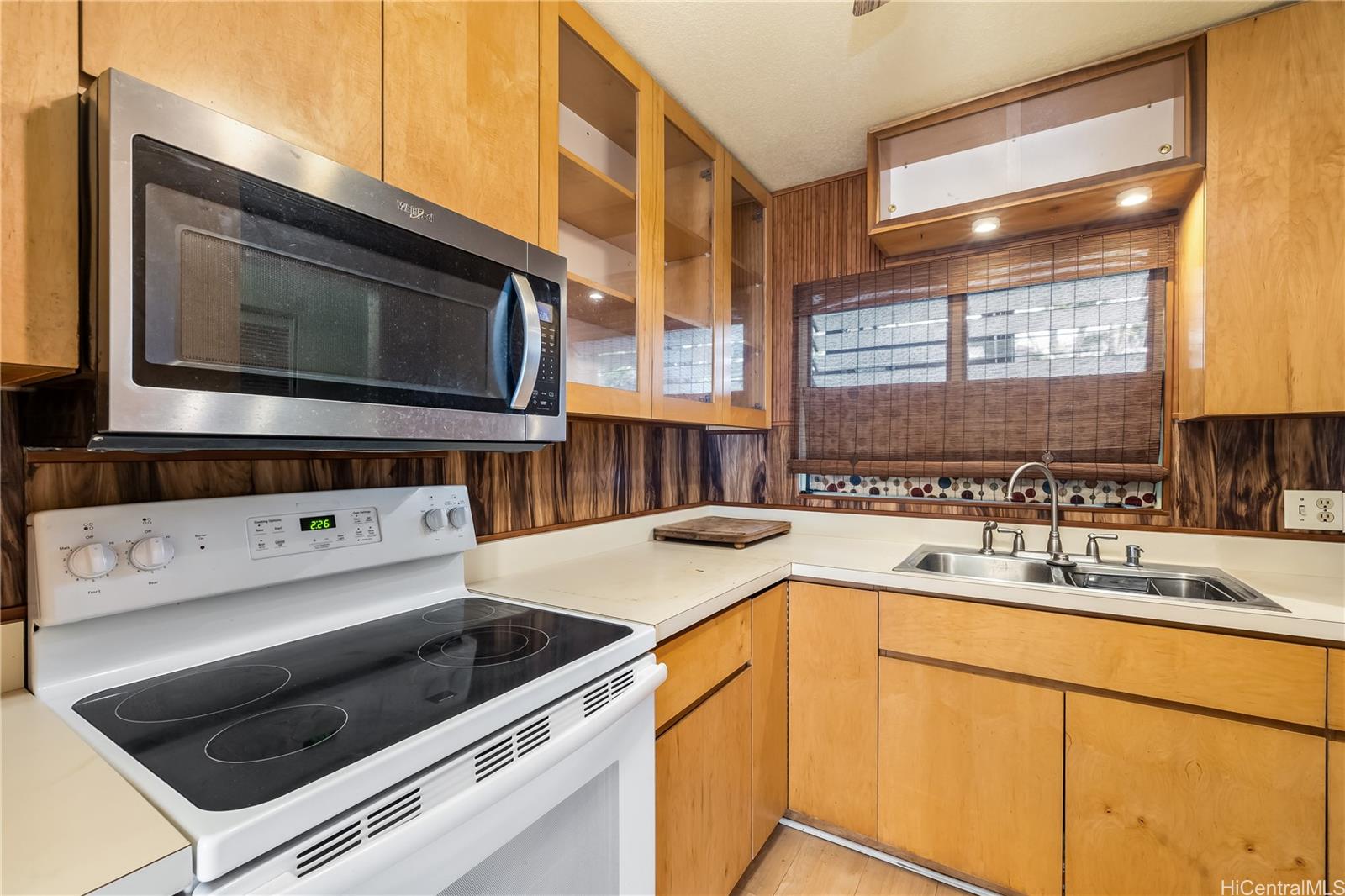 96-214 Waiawa Road, Unit 85 Pearl City, HI 96782 - Photo 5 of 10 a kitchen with a stove microwave and sink
