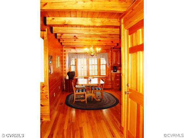 4826 Tatum Road Disputanta, VA 23842 - Photo 12 of 24 a view of a dining room with a table and chairs