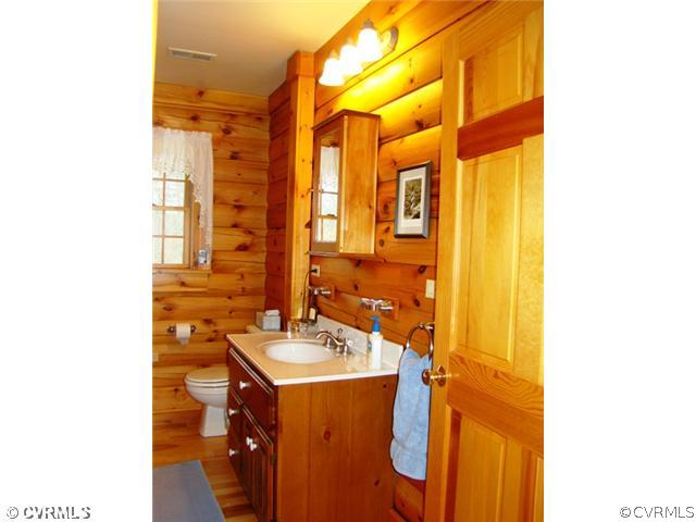 4826 Tatum Road Disputanta, VA 23842 - Photo 18 of 24 a bathroom with a sink and a mirror