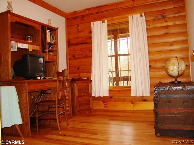 4826 Tatum Road Disputanta, VA 23842 - Photo 20 of 24 a living room filled with furniture and a window