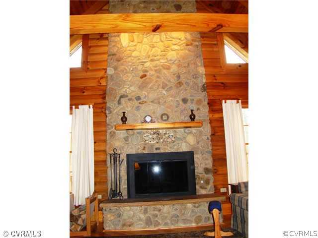 4826 Tatum Road Disputanta, VA 23842 - Photo 7 of 24 a living room with a fireplace