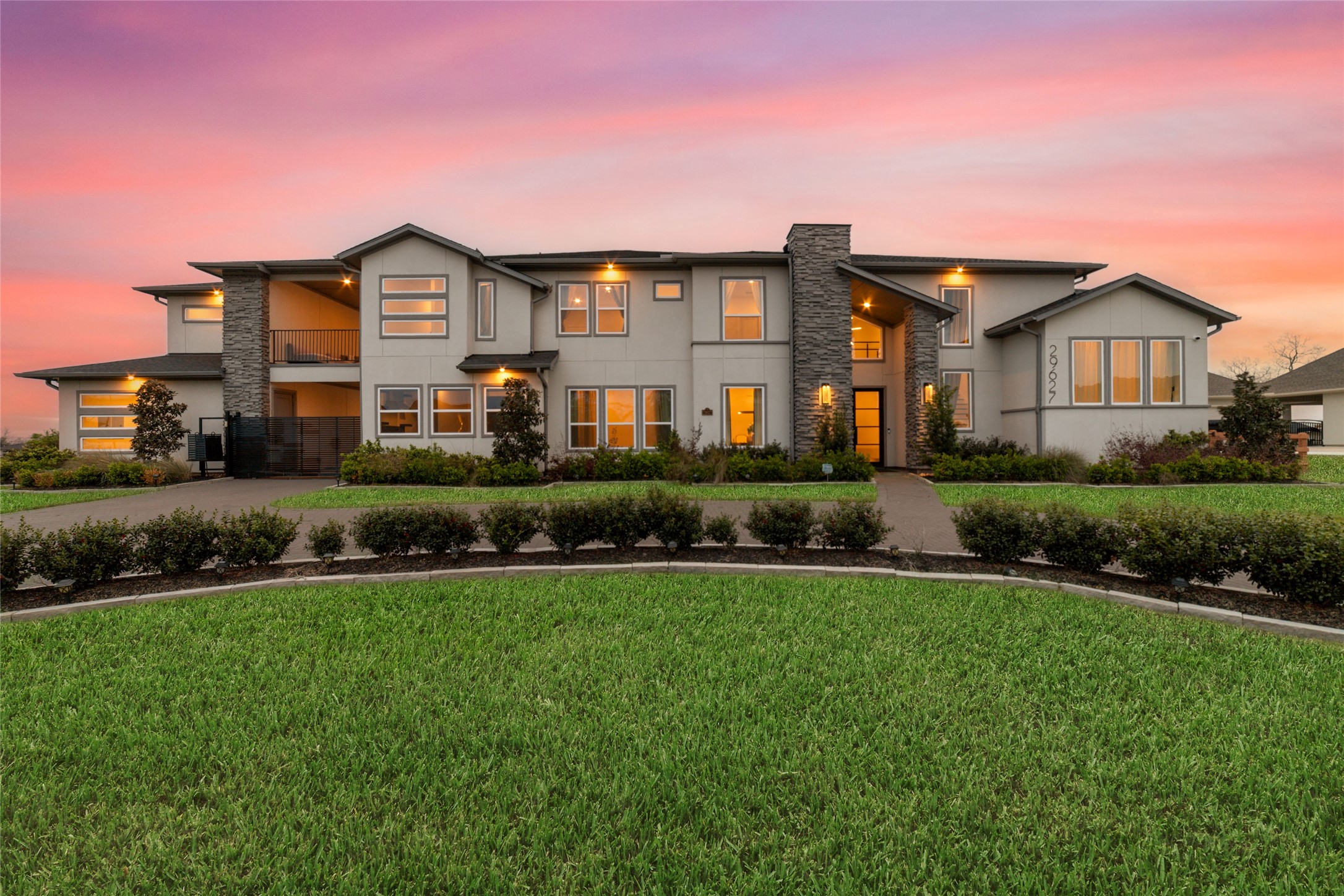 29627 Cir S Rnch Trail Fulshear, TX 77406 - Photo 2 of 50 As evening settles in, the home takes on an entirely new personality. Reflections across the water, glowing interiors, and a backyard designed for nights you'll never want to end.