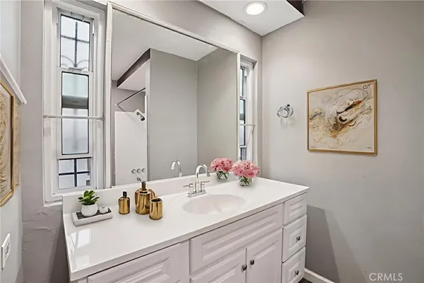 a bathroom with a sink and a mirror