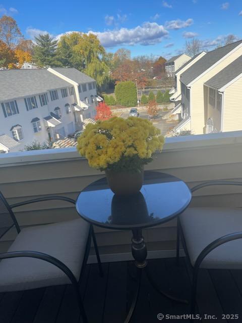 163 South Street, Unit 85 Danbury, CT 06810 - Photo 17 of 18 a view of a dining room with furniture and wooden floor