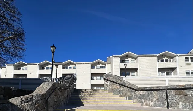 a front view of a building with many windows