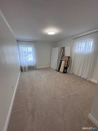 a view of an empty room and a window