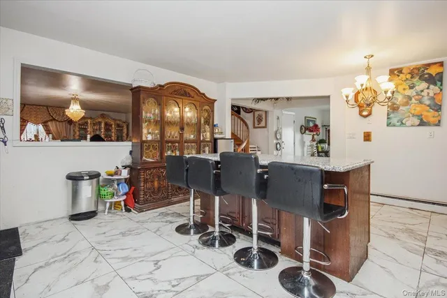 a view of a livingroom with furniture and a potted plant