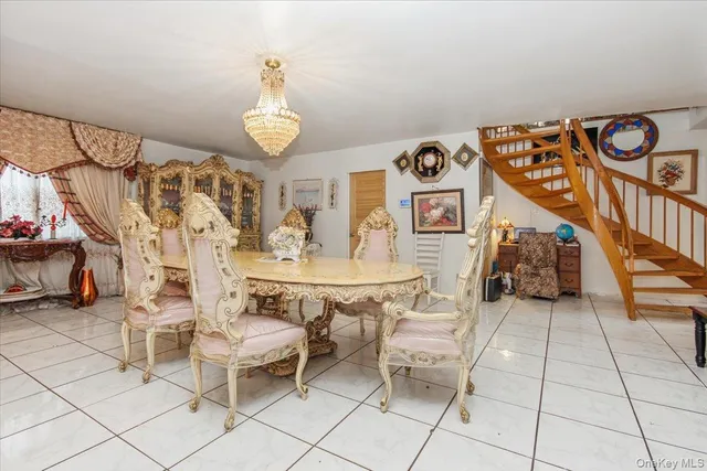 a view of a livingroom with furniture and a chandelier