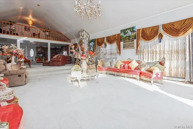 an outdoor space with patio furniture and a chandelier