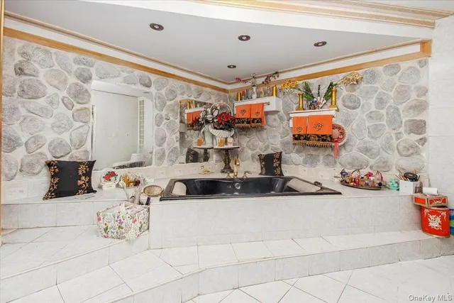 a bathroom with a sink mirror and vanity