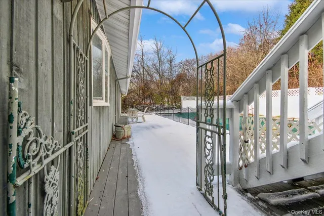 a view of a balcony with wooden floor and stairs