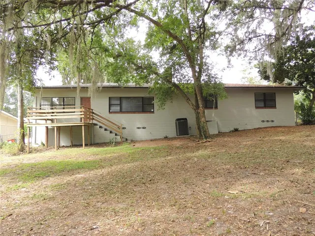 a backyard of a house with lots of green space