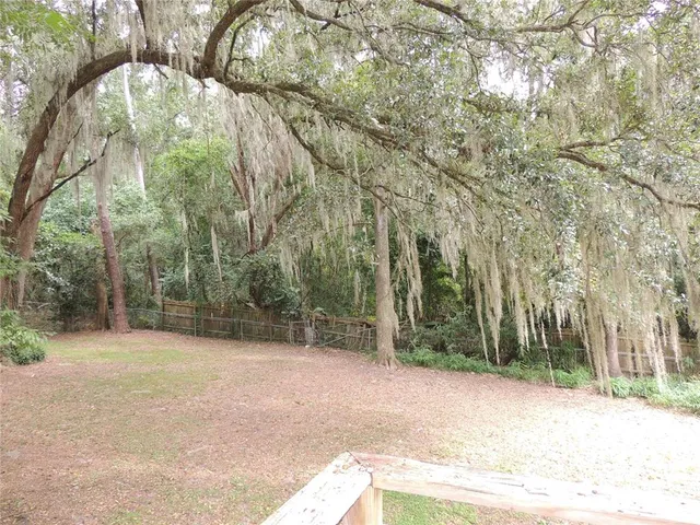 a view of a house with a small yard
