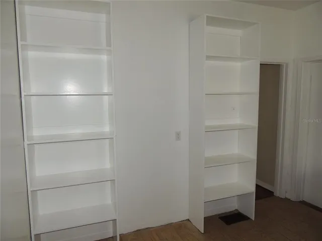 a view of an empty walk in closet