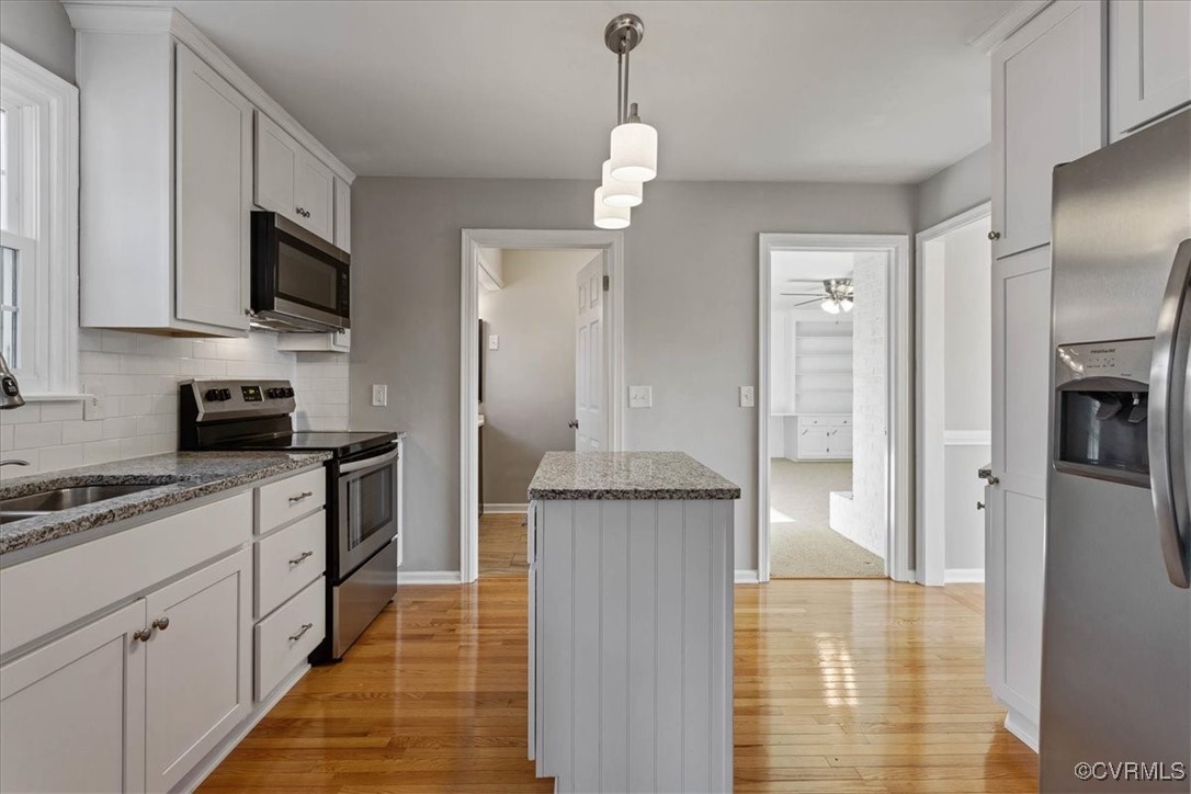 1007 Forestview Drive Colonial Heights, VA 23834 - Photo 15 of 40 Kitchen with stone counters, white cabinetry, and