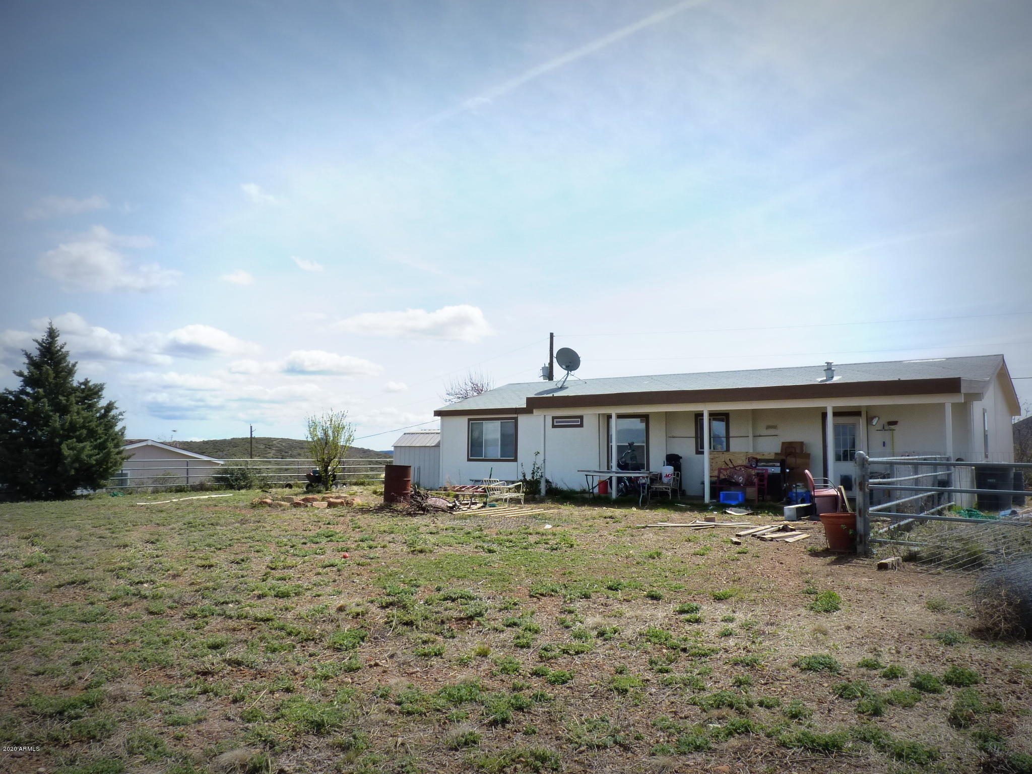 10810 Powerline Road Dewey, AZ 86327 - Photo 29 of 50 Gated Back Yard view towards the hous