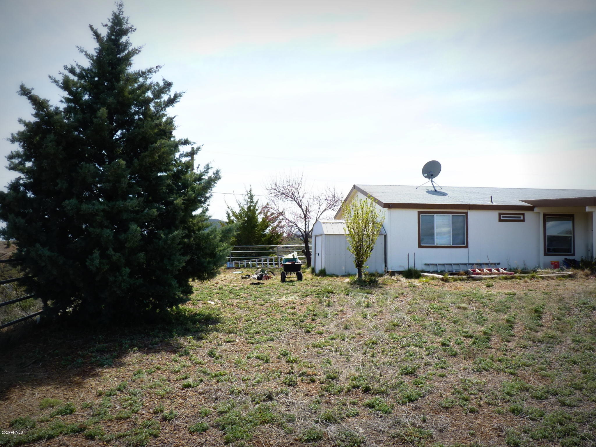 10810 Powerline Road Dewey, AZ 86327 - Photo 33 of 50 Gated Back Yard view towards the hous