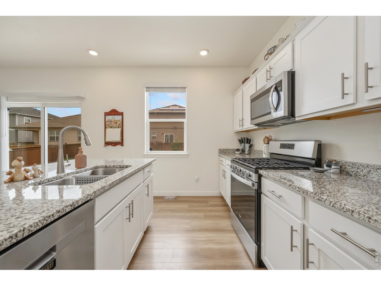 352 Bluebird Road Johnstown, CO 80534 - Photo 11 of 26 Granite counters and upgraded appliances
