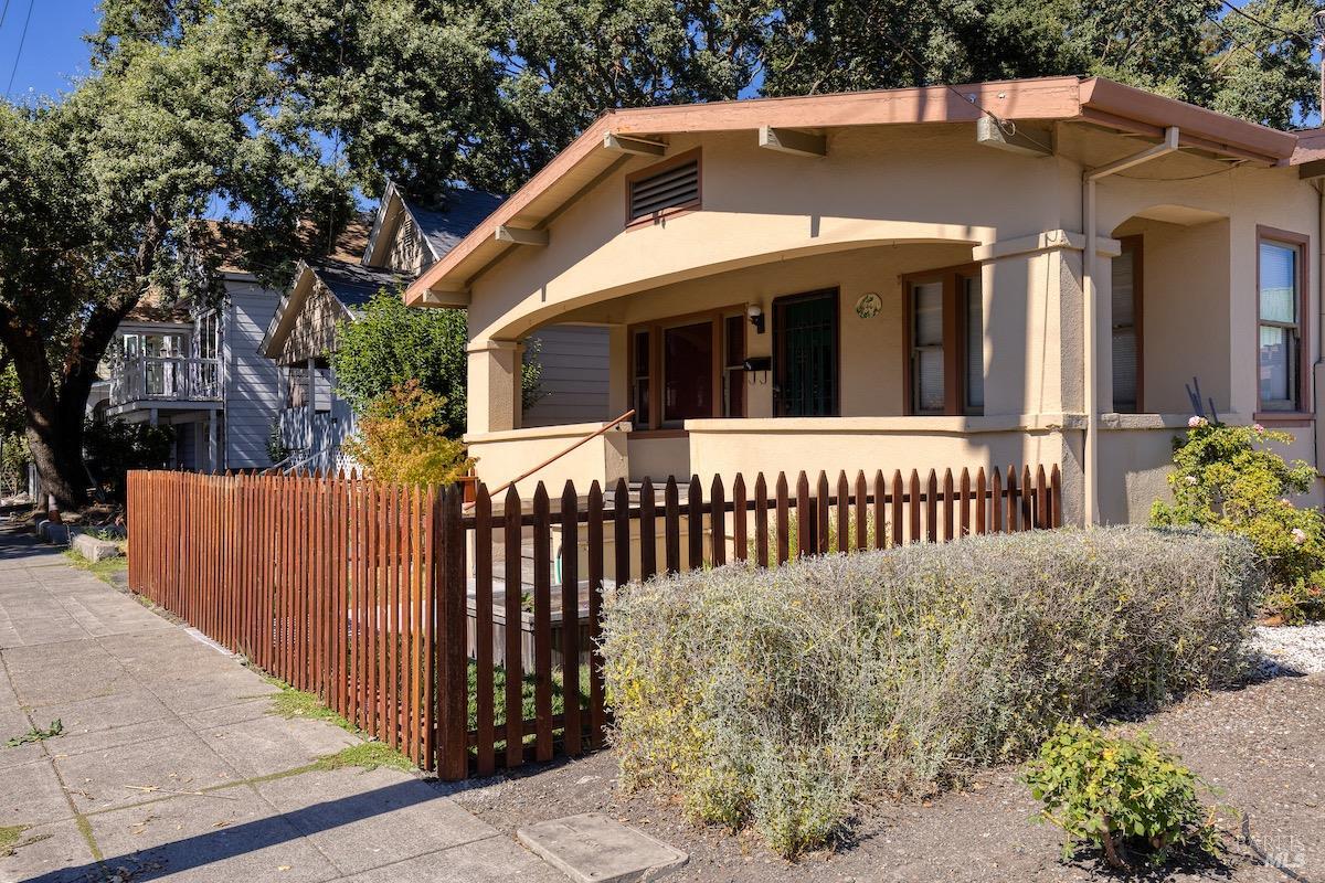a view of a house with a small yard