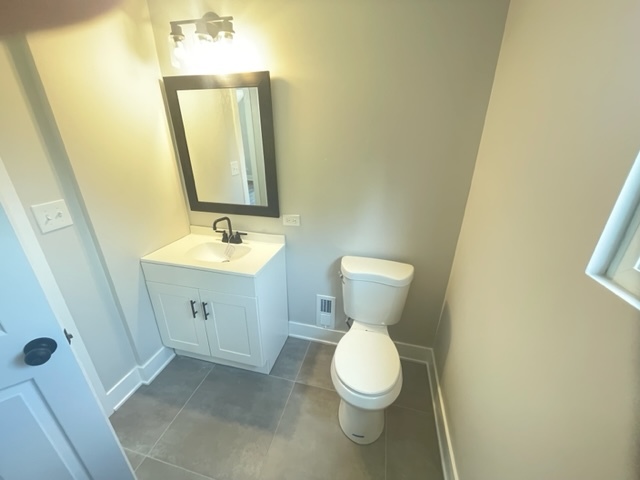 30 Apache Street Park Forest, IL 60466 - Photo 13 of 13 a bathroom with a sink and a mirror