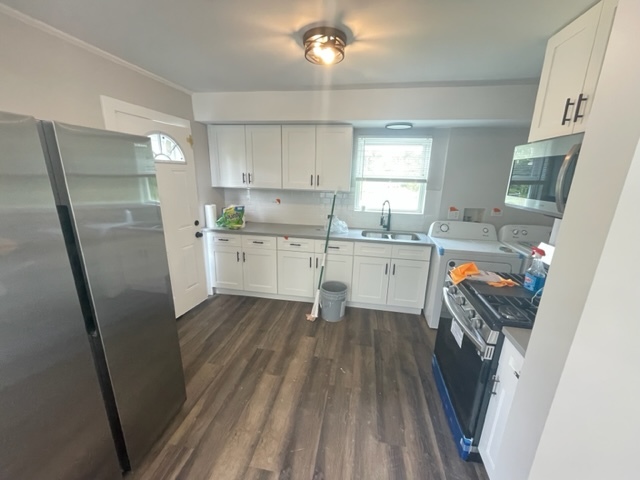 30 Apache Street Park Forest, IL 60466 - Photo 5 of 13 a kitchen with a sink a refrigerator a stove and cabinets