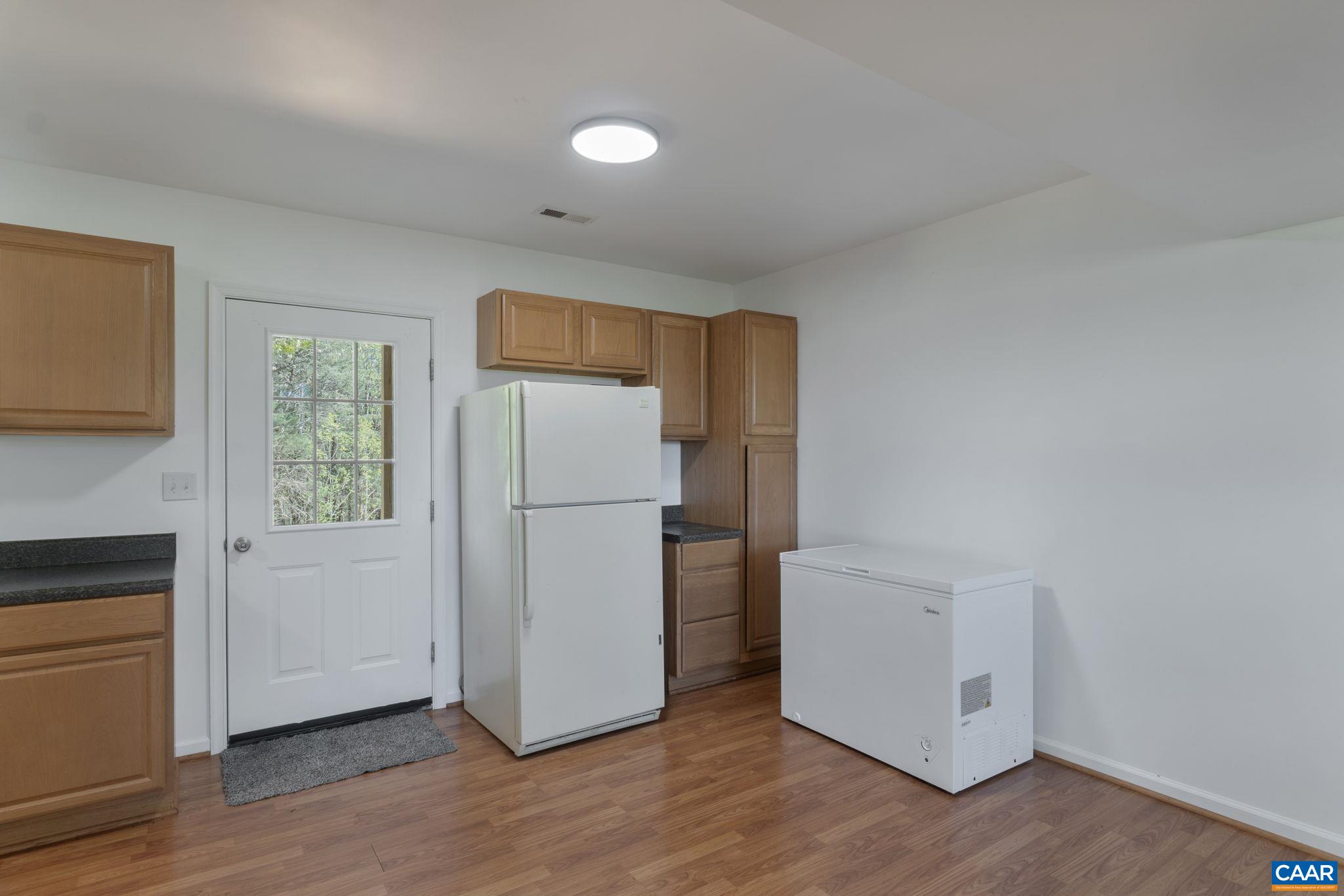 3580 Welsh Run Road Ruckersville, VA 22968 - Photo 26 of 44 a utility room with wooden floor washer and dryer