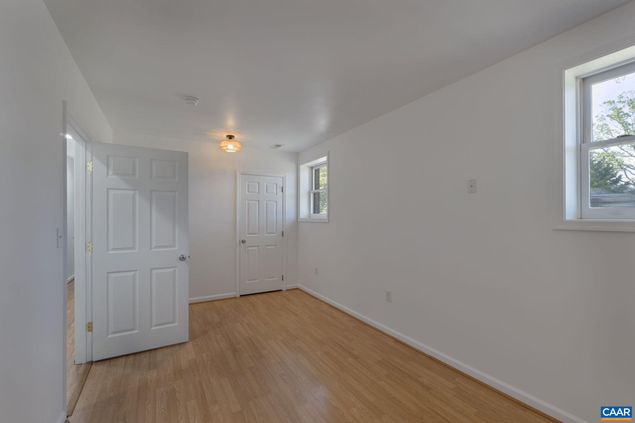 3580 Welsh Run Road Ruckersville, VA 22968 - Photo 29 of 44 a view of empty room with wooden floor and fan