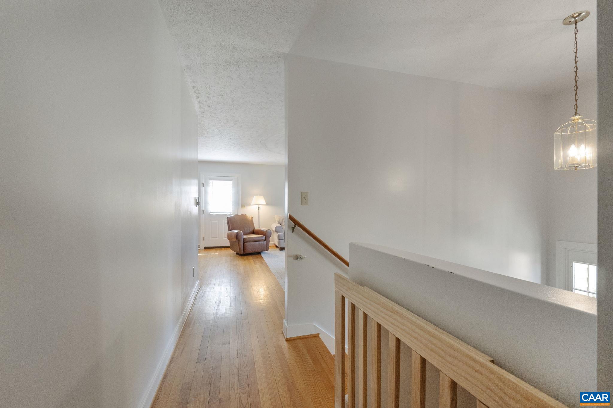 3580 Welsh Run Road Ruckersville, VA 22968 - Photo 33 of 44 a view of a hallway view with wooden floor and staircase