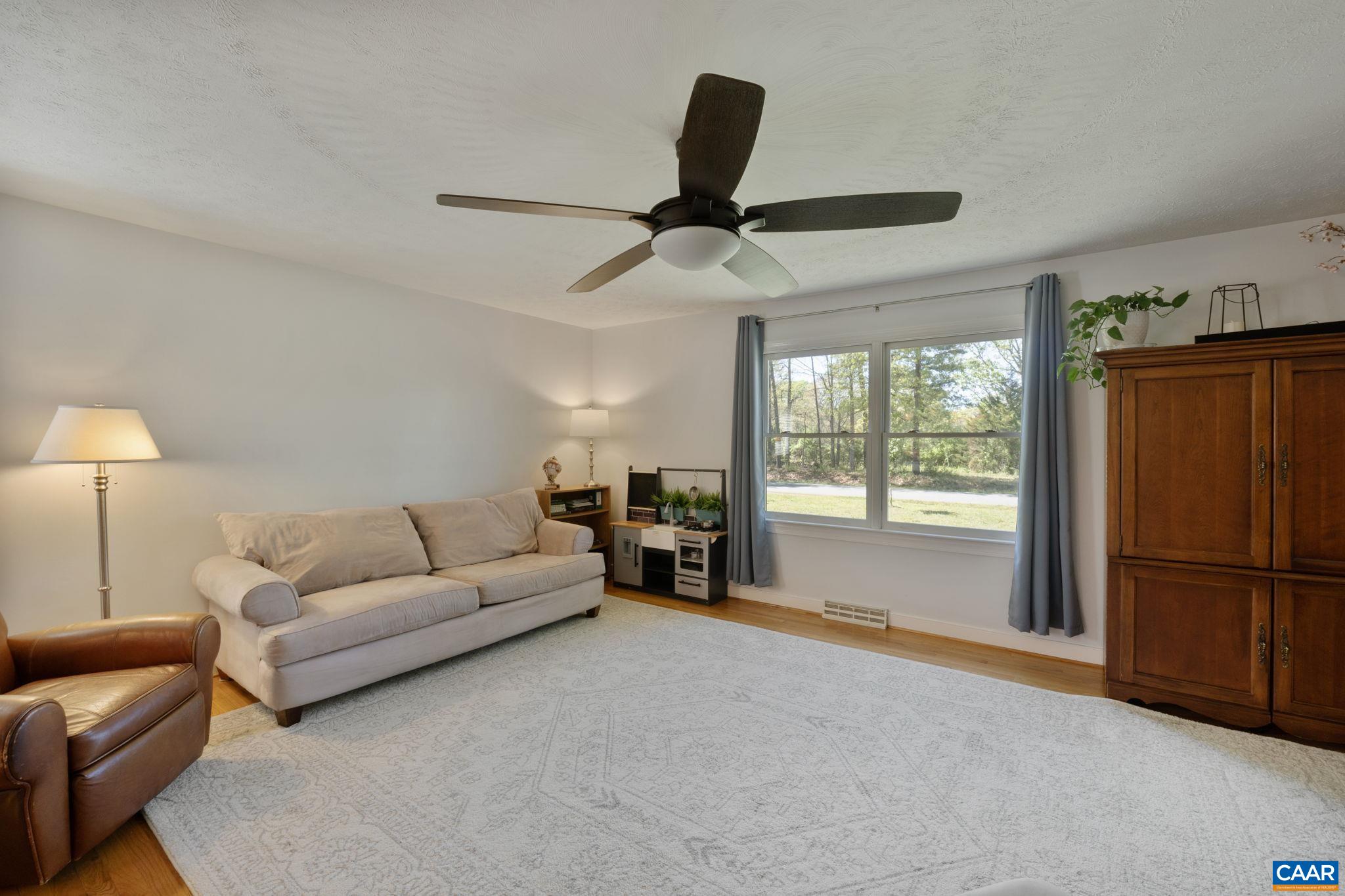 3580 Welsh Run Road Ruckersville, VA 22968 - Photo 6 of 44 a living room with furniture and a large window