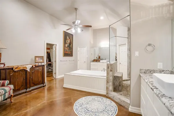 a bathroom with a sink a mirror and a shower