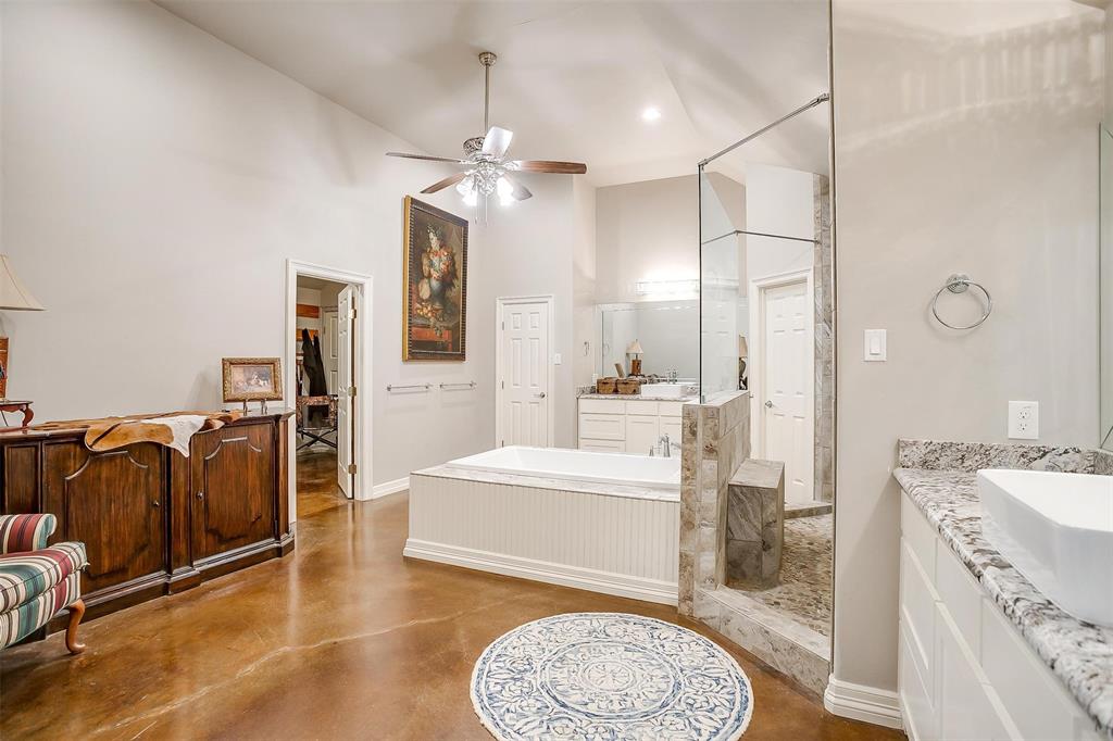 819 Old Annetta Road Aledo, TX 76008 - Photo 22 of 39 a spacious bathroom with a granite countertop sink a mirror and shower
