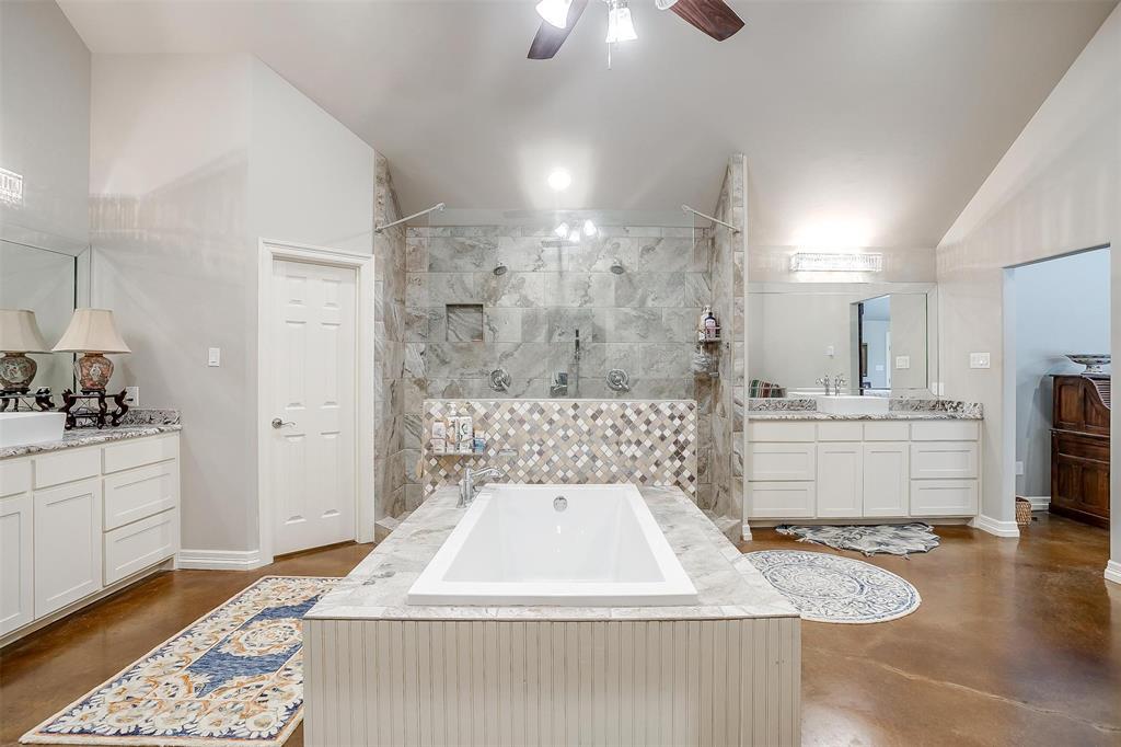 819 Old Annetta Road Aledo, TX 76008 - Photo 23 of 39 a bathroom with a sink a mirror and a shower