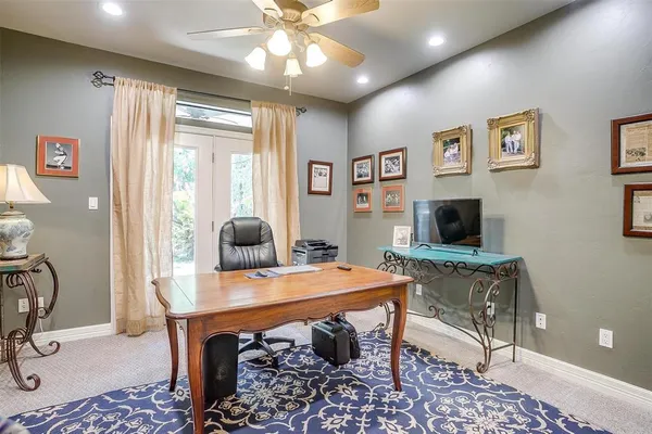 a bedroom with furniture and a chandelier