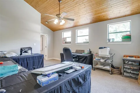 a bedroom with bed and a chandelier