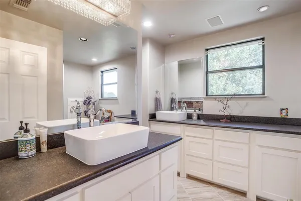 a bathroom with a shower and a sink