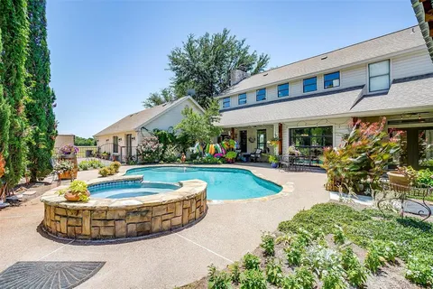 a view of a swimming pool with a patio