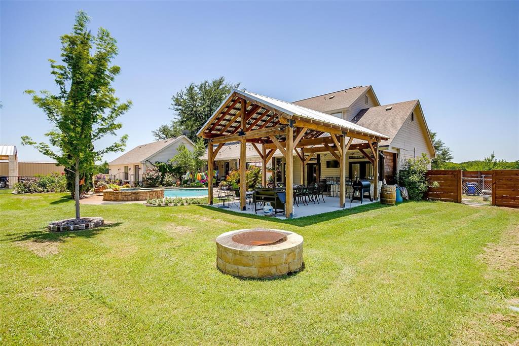 819 Old Annetta Road Aledo, TX 76008 - Photo 36 of 39 a view of a swimming pool with lawn chairs and plants