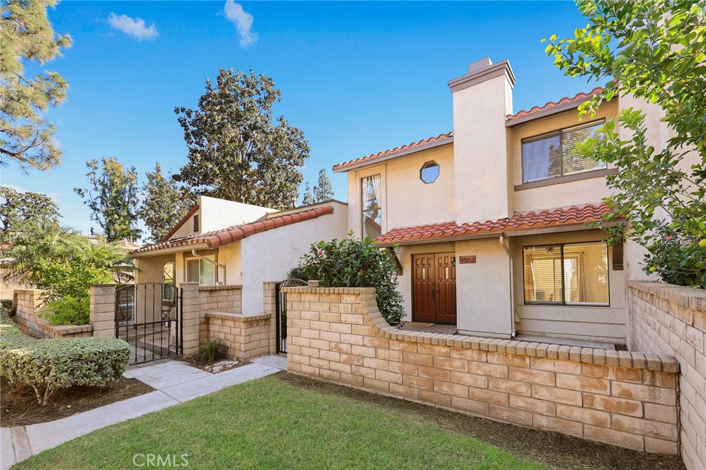 9862 Solazzo Drive Rancho Cucamonga, CA 91730 - Photo 2 of 30 front view of a house with a yard