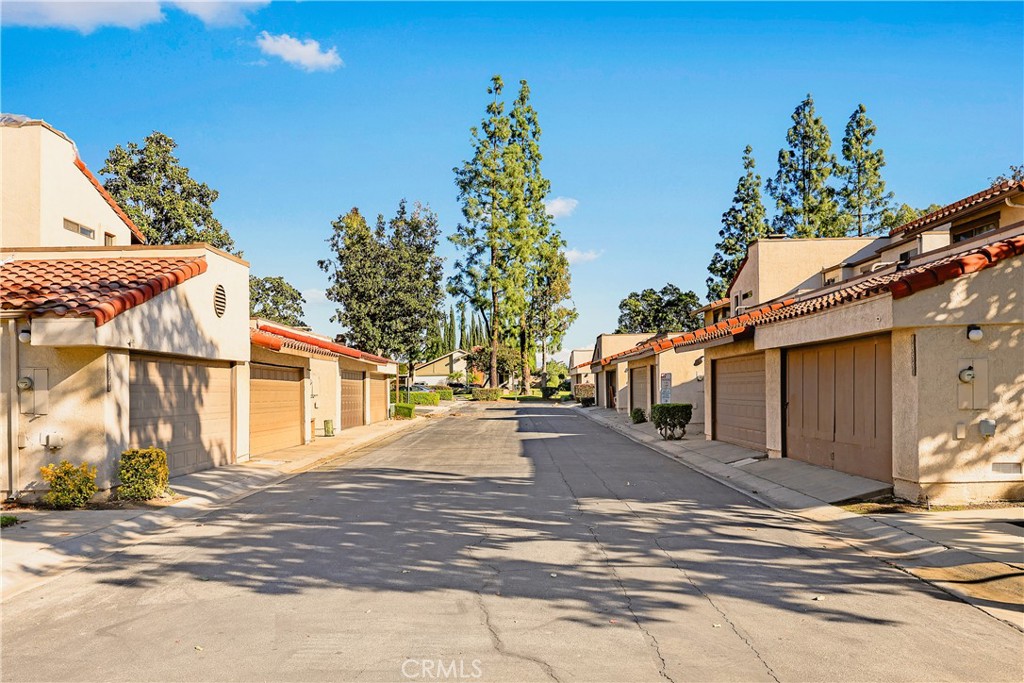 9862 Solazzo Drive Rancho Cucamonga, CA 91730 - Photo 29 of 30 a view of a street with a house in the background