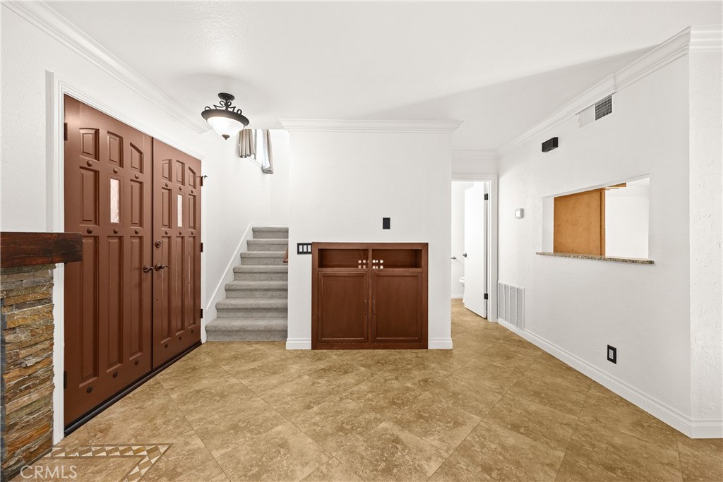 9862 Solazzo Drive Rancho Cucamonga, CA 91730 - Photo 6 of 30 a view of a hallway to a house and an empty room