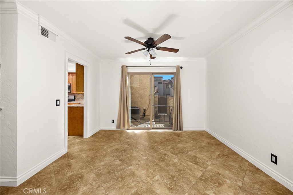 9862 Solazzo Drive Rancho Cucamonga, CA 91730 - Photo 10 of 30 a view of a livingroom with a chandelier fan and windows
