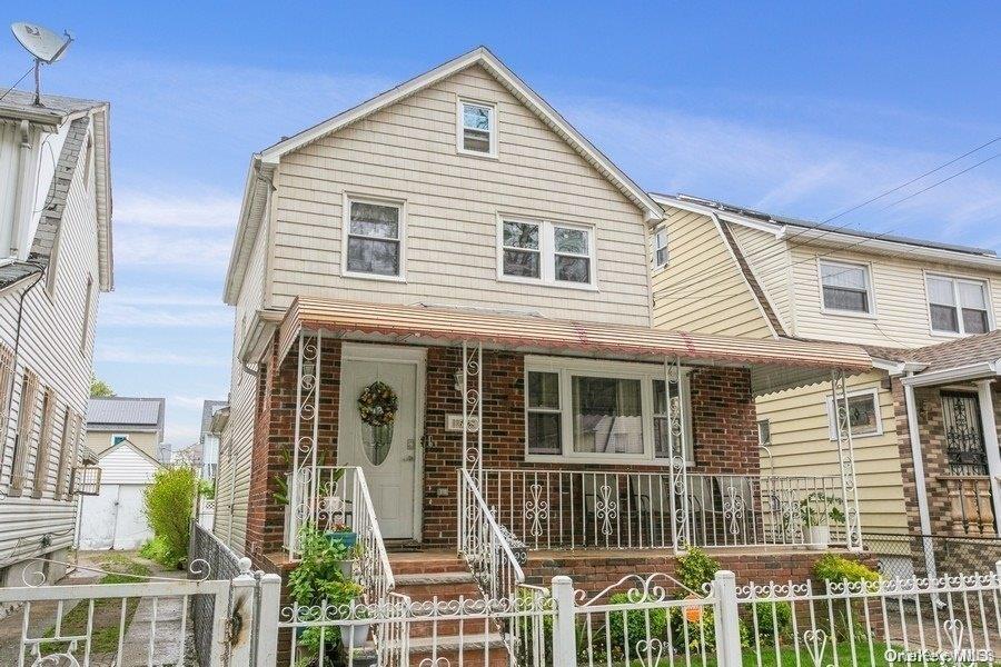 115-29 198th Street, Unit 1 Queens, NY 11412 - Photo 12 of 12 a front view of a house with a porch