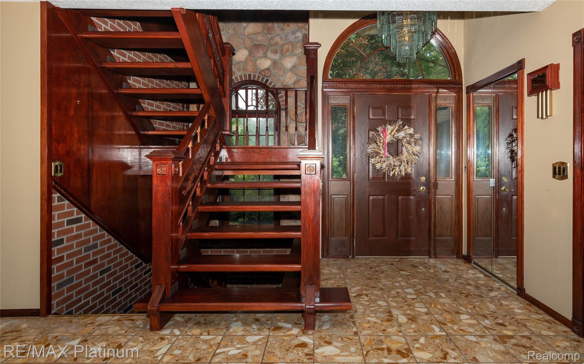 366 North Hughes Road Howell, MI 48843 - Photo 10 of 46 Beautiful entry with wood, marble and stone