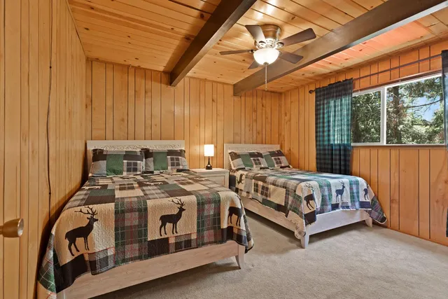 a bed room with a bed and a window