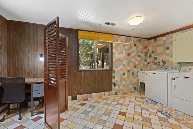 a view of empty room with wooden floor and cabinet