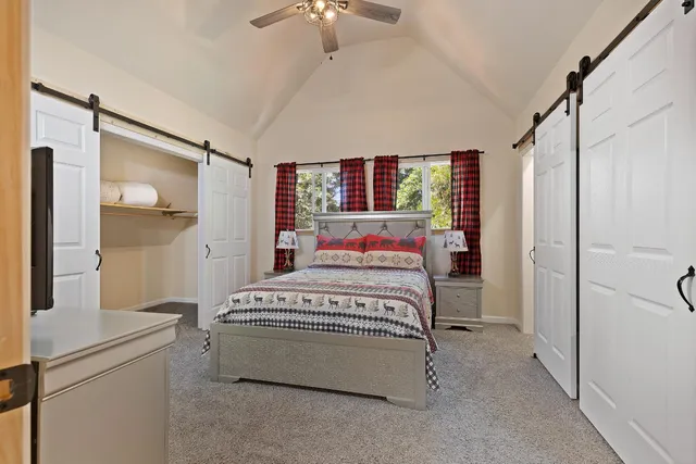 a bedroom with a bed dresser and a window