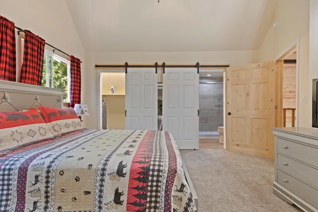 a bedroom with a bed and a cabinets