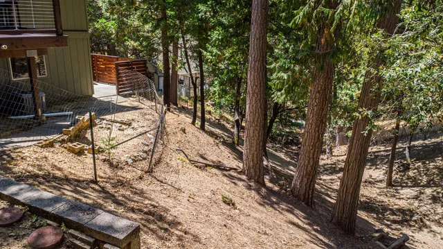 a view of a backyard of the house