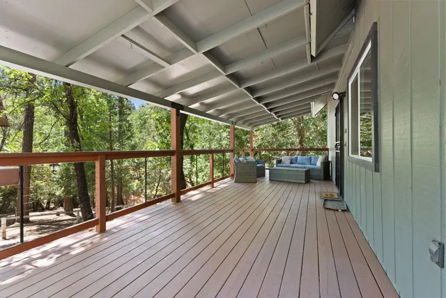 a view of a balcony with wooden floor