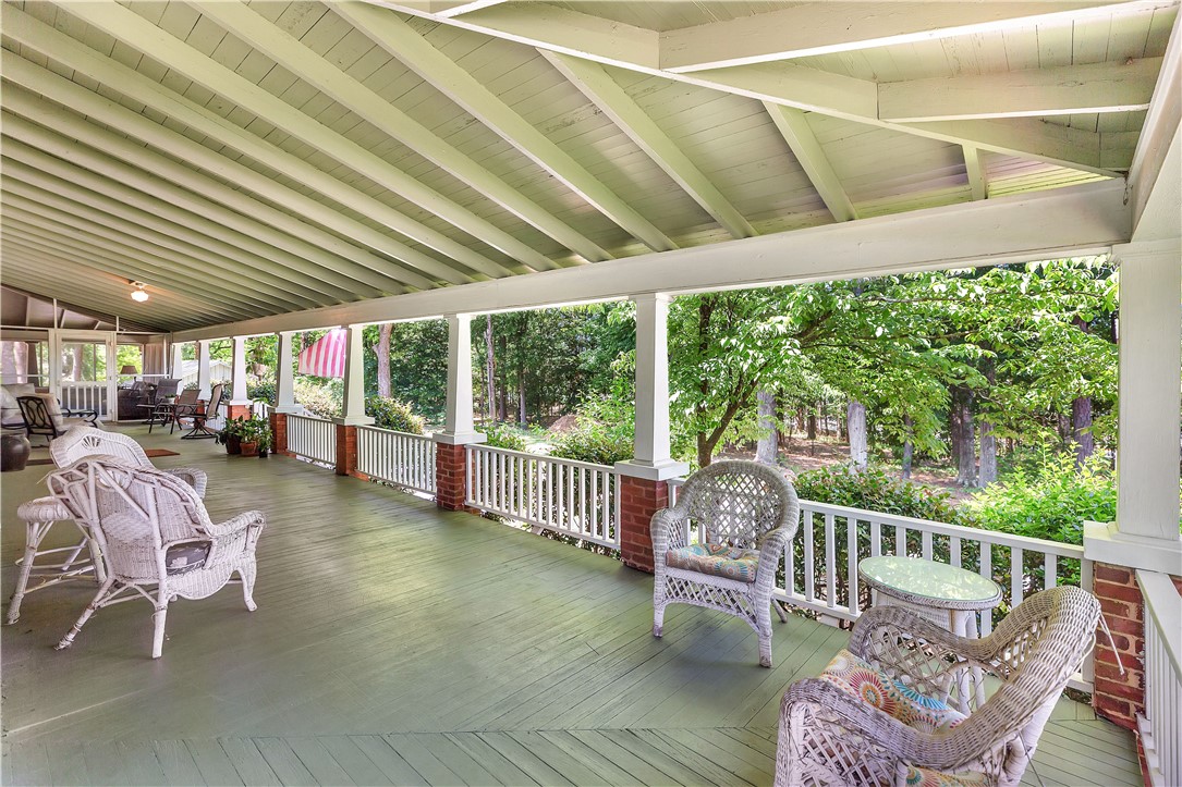 205 West Mauldin Street Walhalla, SC 29691 - Photo 33 of 43 An inviting veranda overlooking natural woodlands, perfect for tranquil outdoor enjoyment.